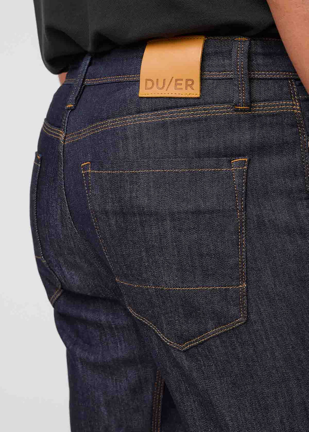DU/ER PERF DENIM ATHLETIC TAPER JEANS